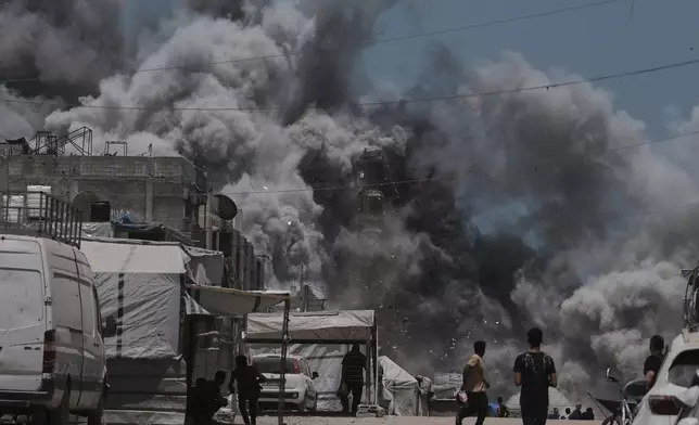Smoke rises to the sky following an Israeli strike in Gaza City, Sunday, June 1, 2025. (AP Photo/Jehad Alshrafi)