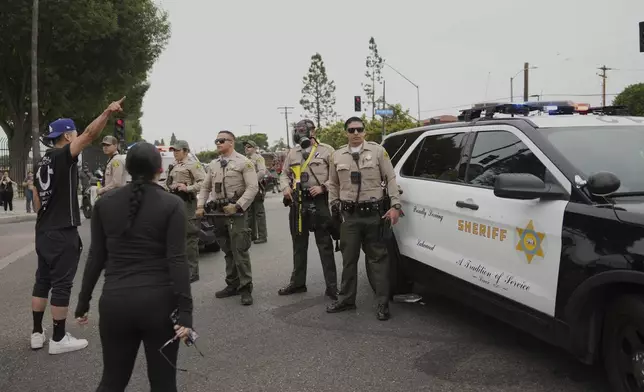 Protesters confront Border Patrol personnel during a demonstration in the Paramount section of Los Angeles on Saturday, June 7, 2025 (AP Photo/Eric Thayer)