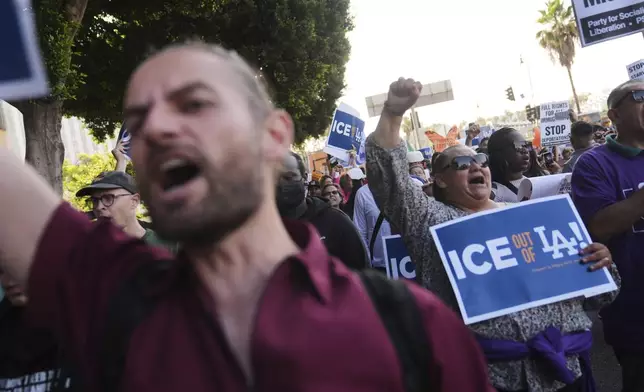 Protesters march after federal immigration authorities conducted an operation on Friday, June 6, 2025, in Los Angeles. (AP Photo/Jae C. Hong)