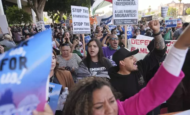 Protesters march after federal immigration authorities conducted an operation on Friday, June 6, 2025, in Los Angeles. (AP Photo/Jae C. Hong)