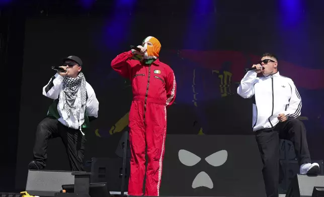 Hip hop trio Kneecap perform during the Glastonbury Festival in Worthy Farm, Somerset, England, Saturday, June 28, 2025. (Scott A Garfitt/Invision/AP)