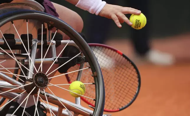 Netherlands' Aniek Van Koot serves against Japan's Manami Tanaka during their women's wheelchair singles quarterfinal match of the French Tennis Open at the Roland-Garros stadium in Paris, Thursday, June 5, 2025. (AP Photo/Lindsey Wasson)