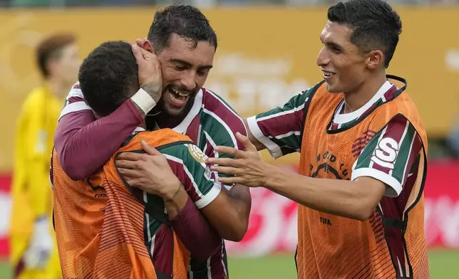 Fluminense's Juan Pablo Freytes, center, celebrates with teammates after scoring a goal against Ulsan HD during the second half of a Club World Cup group F soccer match, Saturday, June 21, 2025, in East Rutherford, N.J. (AP Photo/Seth Wenig)