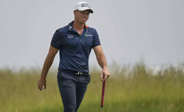 Viktor Hovland, of Norway, reacts after making double bogey on the second hole during the second round of the U.S. Open golf tournament at Oakmont Country Club Friday, June 13, 2025, in Oakmont, Pa. (AP Photo/Charlie Riedel)