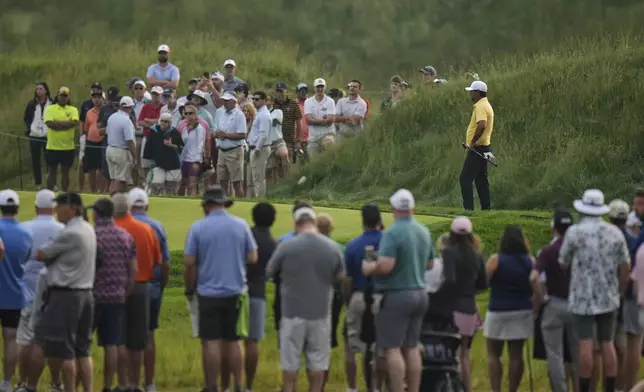 Brooks Koepka prepares to putt on the 10th hole during the second round of the U.S. Open golf tournament at Oakmont Country Club Friday, June 13, 2025, in Oakmont, Pa. (AP Photo/Seth Wenig)