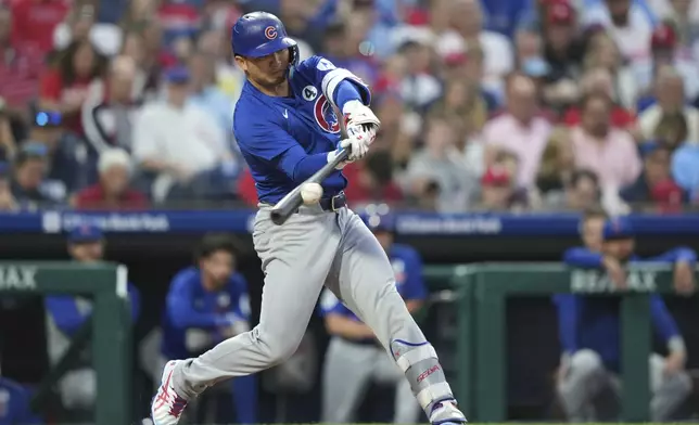 Chicago Cubs' Seiya Suzuki hits a single against Philadelphia Phillies pitcher Zack Wheeler during the sixth inning of a baseball game Monday, June 9, 2025, in Philadelphia. (AP Photo/Matt Slocum)