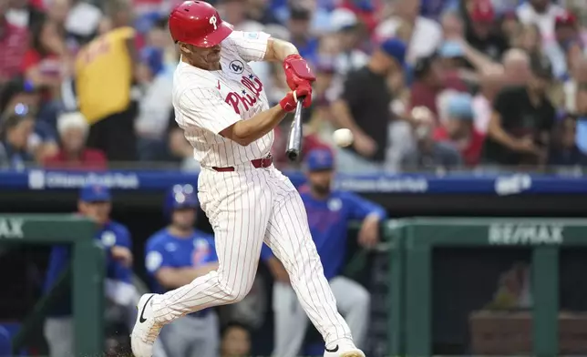 Philadelphia Phillies' Otto Kemp hits a single against Chicago Cubs pitcher Matthew Boyd during the fifth inning of a baseball game Monday, June 9, 2025, in Philadelphia. (AP Photo/Matt Slocum)