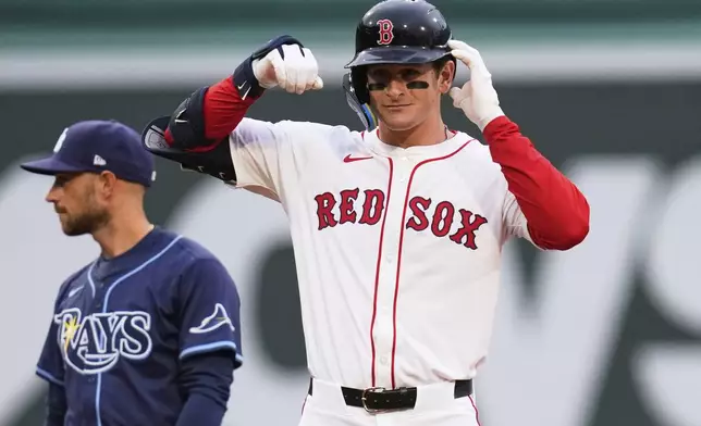 Boston Red Sox rookie Roman Anthony celebrates after his two RBI double, his first major league hit, during the first inning of a baseball game against the Tampa Bay Rays at Fenway Park, Tuesday, June 10, 2025, in Boston. (AP Photo/Charles Krupa)