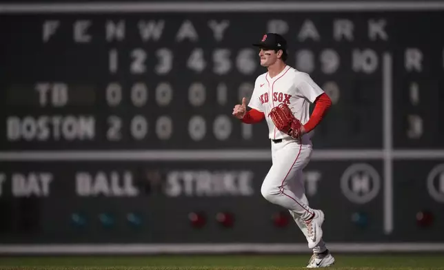 Boston Red Sox outfielder Roman Anthony heads to the dugout after defeating the Tampa Bay Rays in a baseball game at Fenway Park, Tuesday, June 10, 2025, in Boston. (AP Photo/Charles Krupa)