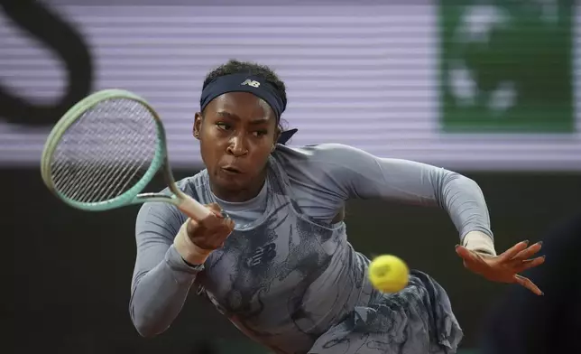 Coco Gauff of the U.S. plays a shot against Madison Keys of the U.S. during their quarterfinal match of the French Tennis Open at the Roland-Garros stadium in Paris, Wednesday, June 4, 2025. (AP Photo/Christophe Ena)