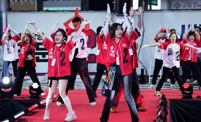 Supporters of Kim Moon Soo, presidential candidate with the People Power Party, perform during his election campaign rally in Seoul, South Korea, late Monday, June 2, 2025. (AP Photo/Ahn Young-joon)