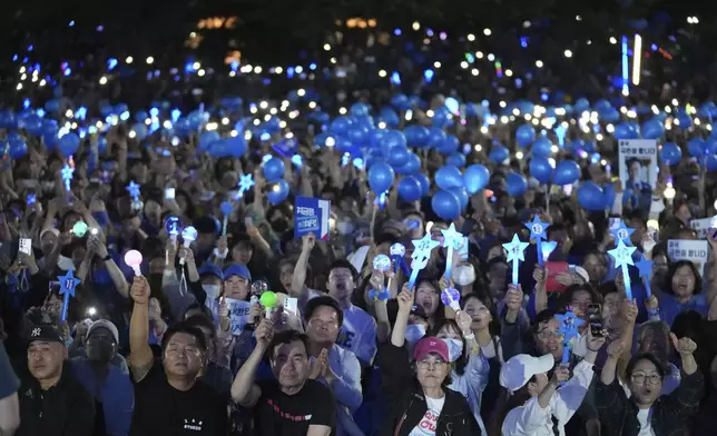 Supporters of South Korea's Democratic Party's presidential candidate Lee Jae-myung, cheer during a presidential election campaign in Seoul, South Korea, Monday, June 2, 2025. (AP Photo/Lee Jin-man)