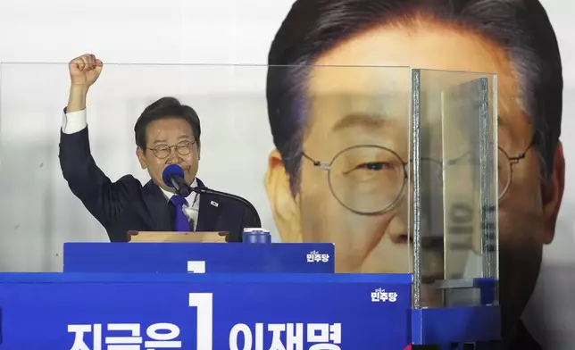 South Korea's Democratic Party's presidential candidate Lee Jae-myung, gestures as he speaks to supporters outside of the National Assembly in Seoul, South Korea, Wednesday, June 4, 2025. (AP Photo/Lee Jin-man)