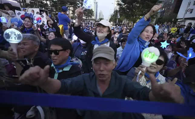 Supporters of South Korea's Democratic Party's presidential candidate Lee Jae-myung, react outside the National Assembly in Seoul, South Korea, Tuesday, June 3, 2025. (AP Photo/Lee Jin-man)