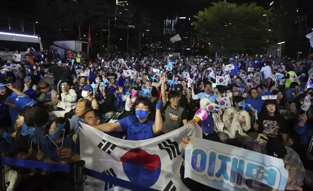 Supporters of South Korea's Democratic Party's presidential candidate Lee Jae-myung, react outside of the National Assembly in Seoul, South Korea, Tuesday, June 3, 2025. (AP Photo/Lee Jin-man)