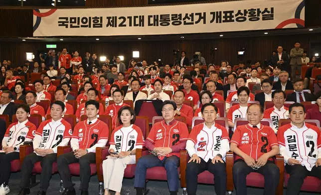 Lawmakers of the People Power Party watch television coverage of the exit polls for the presidential election at the National assembly in Seoul, South Korea, Tuesday June 3, 2025. (Song Kyung Seok/Pool via AP)