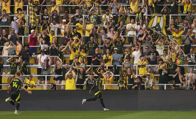 Columbus Crew forward Ibrahim Aliyu (11) reacts after scoring during the first half of an MLS soccer match against the Vancouver Whitecaps, Saturday, June 14, 2025, in Columbus, Ohio. (AP Photo/Jeff Dean)