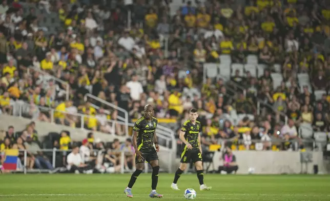 Columbus Crew midfielder Darlington Nagbe, left, controls the ball during the second half of an MLS soccer match against the Vancouver Whitecaps Saturday, June 14, 2025, in Columbus, Ohio. (AP Photo/Jeff Dean)
