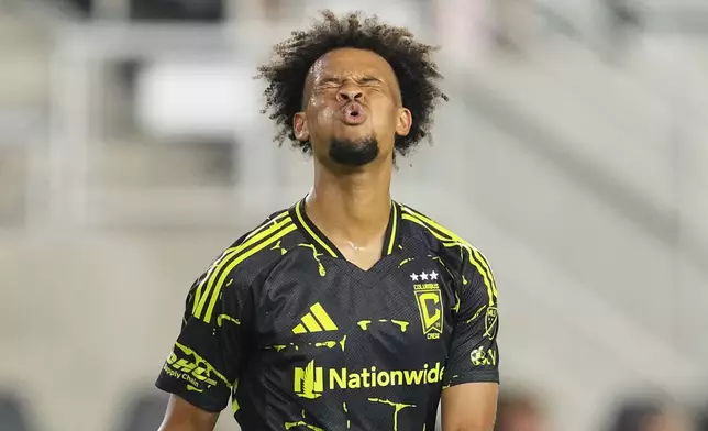Columbus Crew forward Jacen Russell-Rowe reacts after a missed shot on goal during the second half of an MLS soccer match against the Vancouver Whitecaps, Saturday, June 14, 2025, in Columbus, Ohio. (AP Photo/Jeff Dean)