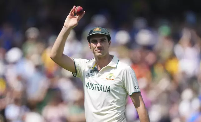 Australia's captain Pat Cummins holds up the ball to celebrate his six-wicket haul on day two of the World Test Championship final between South Africa and Australia at Lord's cricket ground in London, Thursday, June 12, 2025. (AP Photo/Kirsty Wigglesworth)