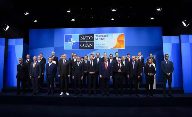 CORRECTS SPELLING TO HAGUE NOT HAUGE Canadian Prime Minister Mark Carney, front left, takes part in the official family photo during the NATO Summit in The Hague, Netherlands on Wednesday, June 25, 2025. (Sean Kilpatrick/The Canadian Press via AP)