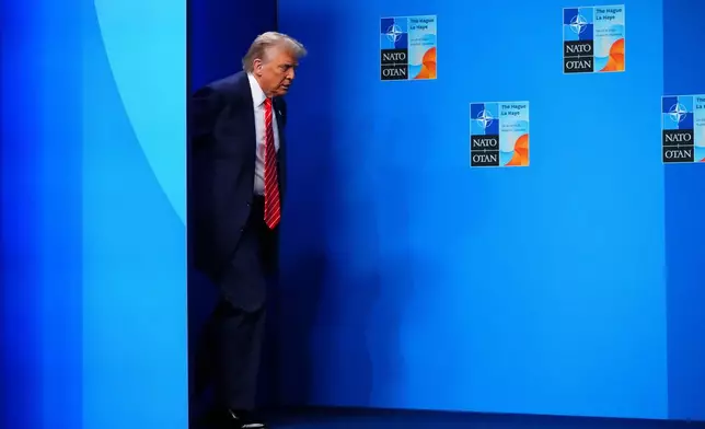 CORRECTS SPELLING TO HAGUE NOT HAUGE U.S. President Donald Trump arrives to be officially greeted by NATO Secretary General Mark Rutte and Netherland's Prime Minister Dick Schoof at the NATO Summit in The Hague, Netherlands on Wednesday, June 25, 2025. (Sean Kilpatrick/The Canadian Press via AP)