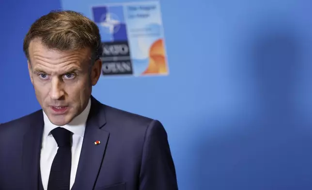 French President Emmanuel Macron speaks during a media conference at the NATO summit in The Hague, Netherlands, Wednesday, June 25, 2025. (AP Photo/Geert Vanden Wijngaert)