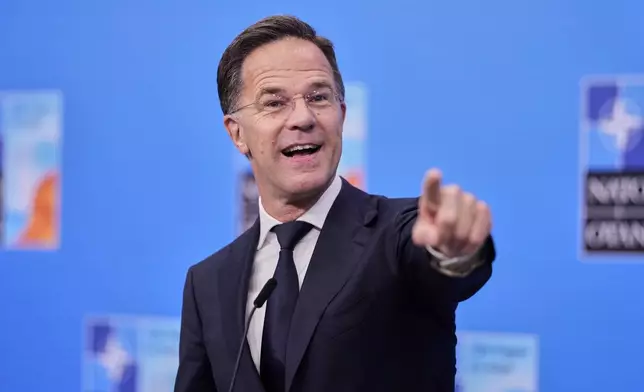 NATO Secretary General Mark Rutte speaks with the media as he arrives for the NATO summit in The Hague, Netherlands, Wednesday, June 25, 2025. (AP Photo/Matthias Schrader)