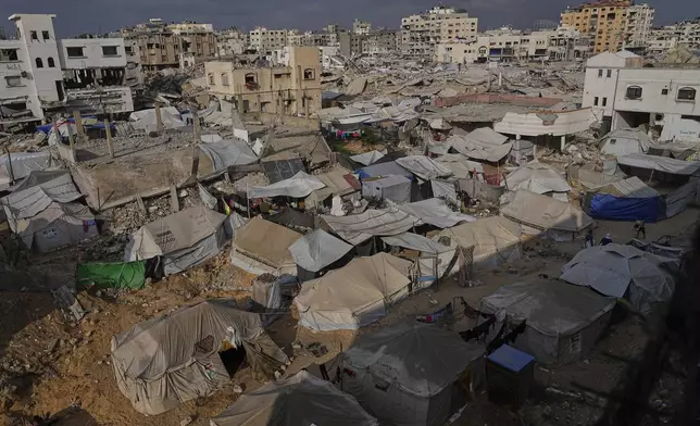 Displaced Palestinians live in a tent camp in Gaza City, Monday, June 23, 2025. (AP Photo/Jehad Alshrafi)