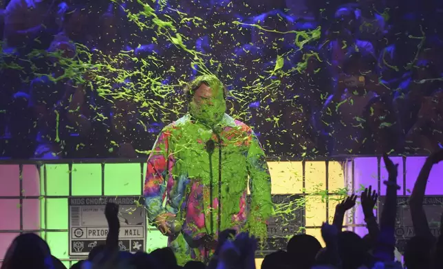 Jack Black gets slimed while accepting the award for king of comedy during the Nickelodeon Kids' Choice Awards on Saturday, June 21, 2025, at The Barker Hangar in Santa Monica, Calif. (AP Photo/Chris Pizzello)