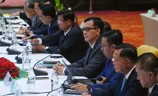Cambodian Minister in charge of State Secretariat of Border Affairs Lam Chea, center, attends a meeting of the Cambodian-Thai joint commission on demarcation for land boundary in Phnom Penh, Cambodia, Saturday, June 14, 2025. (AP Photo/Heng Sinith)