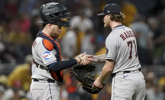 Houston Astros pitcher Josh Hader, right, celebrates with catcher Victor Caratini, left, after getting the final out of a baseball game against the Pittsburgh Pirates, Tuesday, June 3, 2025, in Pittsburgh. (AP Photo/Matt Freed)