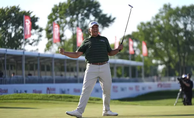 Aldrich Potgieter, of South Africa celebrates his winning putt in a playoff during the final round of the Rocket Classic golf tournament at the Detroit Golf Club, Sunday, June 29, 2025, in Detroit. (AP Photo/Paul Sancya)