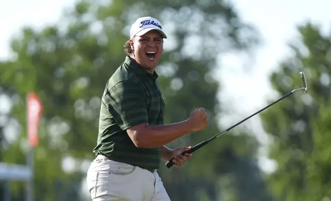Aldrich Potgieter, of South Africa celebrates his winning putt in a playoff during the final round of the Rocket Classic golf tournament at the Detroit Golf Club, Sunday, June 29, 2025, in Detroit. (AP Photo/Paul Sancya)