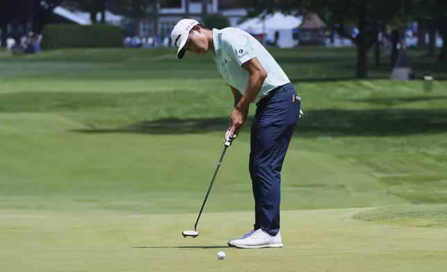 Collin Morikawa hits a birdie putt on the third hole during the final round of the Rocket Classic golf tournament at the Detroit Golf Club, Sunday, June 29, 2025, in Detroit. (AP Photo/Paul Sancya)