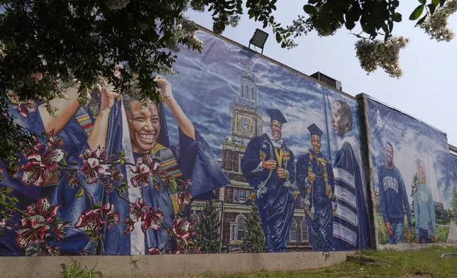 FILE - A graduation themed printed mural is seen on the Howard University campus, July 6, 2021, in Washington. (AP Photo/Jacquelyn Martin, FILE)
