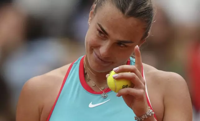 Aryna Sabalenka of Belarus reacts as she plays against Coco Gauff of the U.S. during their final match of the French Tennis Open at the Roland-Garros stadium in Paris, Saturday, June 7, 2025. (AP Photo/Aurelien Morissard)
