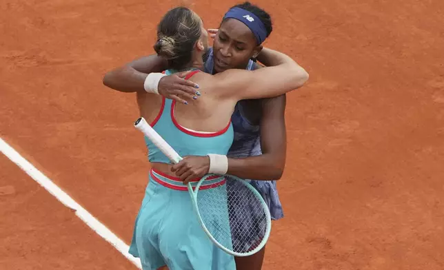 United States' Coco Gauff hugs Aryna Sabalenka of Belarusafter winng the final match of the French Tennis Open at the Roland-Garros in Paris, Saturday, June 7, 2025. (AP Photo/Lindsey Wasson)