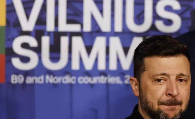 FILE - Ukraine's President Volodymyr Zelenskyy waits for the start of a group photo at the Vilnius Summit at the Palace of the Grand Dukes of Lithuania in Vilnius, Lithuania, June 2, 2025. (AP Photo/Mindaugas Kulbis, File)