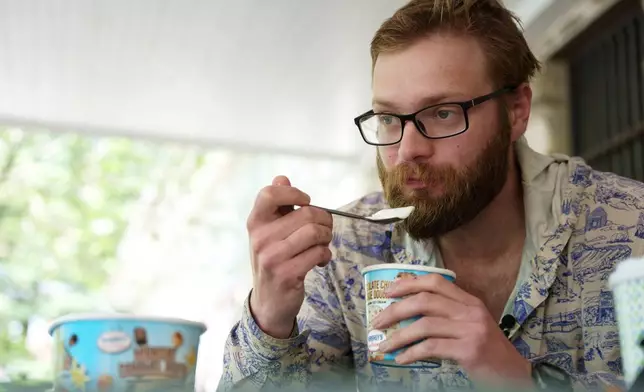 Appalachian Trail thru-hiker Sam Cooper, trail name Pie Top, attempts the half-gallon ice cream challenge at Pine Grove Furnace State Park in Pennsylvania on Tuesday, June 10, 2025. (AP Photo/Mingson Lau)