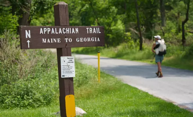 Appalachian Trail thru-hiker Noritaka Mizumoto, from Osaka, Japan, walks the Appalachian Trail at Pine Grove Furnace State Park in Pennsylvania on Tuesday, June 10, 2025. (AP Photo/Mingson Lau)
