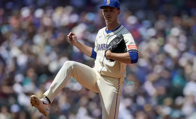 Seattle Mariners starting pitcher Emerson Hancock reacts after a striking out Cleveland Guardians' Carlos Santana in the seventh inning of a baseball game Sunday, June 15, 2025, in Seattle. (AP Photo/John Froschauer)
