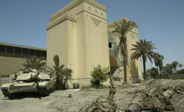 FILE - A U.S. Army tank is parked outside the Iraqi National Museum in Baghdad on May 6, 2003. (AP Photo/Murad Sezer, File)