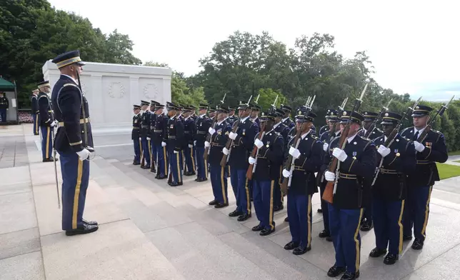 Soldiers prepare ahead of wreath laying ceremony at the Tomb of the Unknown Soldier at Arlington National Cemetery, honoring the Army's 250th anniversary and coinciding with President Donald Trump's 79th birthday, Saturday, June 14, 2025, in Arlington, Va. (AP Photo/Manuel Balce Ceneta)