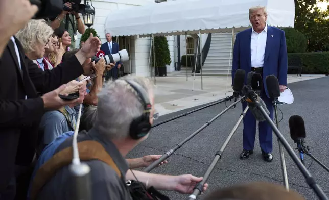 President Donald Trump speaks with reporters before boarding Marine One on the South Lawn of the White House, Tuesday, June 24, 2025, in Washington. (AP Photo/Evan Vucci)