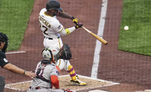 Pittsburgh Pirates' Andrew McCutchen (22) hits a sacrifice fly ball off Houston Astros pitcher Ryan Gusto, driving in a run, during the second inning of a baseball game in Pittsburgh, Wednesday, June 4, 2025. (AP Photo/Gene J. Puskar)