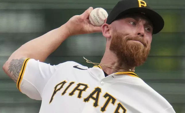 Pittsburgh Pirates pitcher Mike Burrows delivers during the first inning of a baseball game against the Houston Astros in Pittsburgh, Wednesday, June 4, 2025. (AP Photo/Gene J. Puskar)