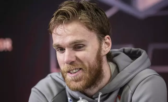 Edmonton Oilers' Connor McDavid (97) speaks to media during a news conference, Tuesday, June 3, 2025, in Edmonton, Alberta, ahead of Game 1 of the NHL hockey Stanley Cup final series against the Florida Panthers. (Jason Franson/The Canadian Press via AP)