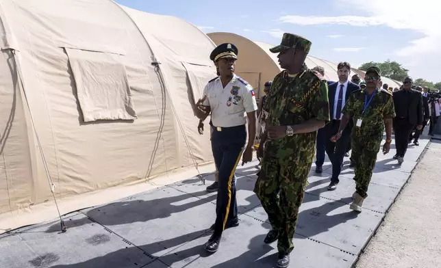 FILE - Godfrey Otunga, Kenyan head of a UN-backed multinational police force, right, speaks to the new Haitian Chief of Police Rameau Normil during a tour for U.S. Ambassador to the United Nations Linda Thomas-Greenfield at their base in Port-au-Prince, Haiti, July 22, 2024. (Roberto Schmidt/Pool Photo via AP, File)