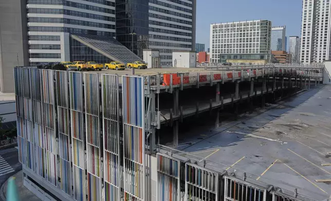 A garage where vehicles caught and a floor of the structure collapsed is seen Tuesday, June 10, 2025, in Nashville, Tenn. (AP Photo/George Walker IV)